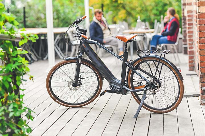 An O2feel e-bike on a wooden deck